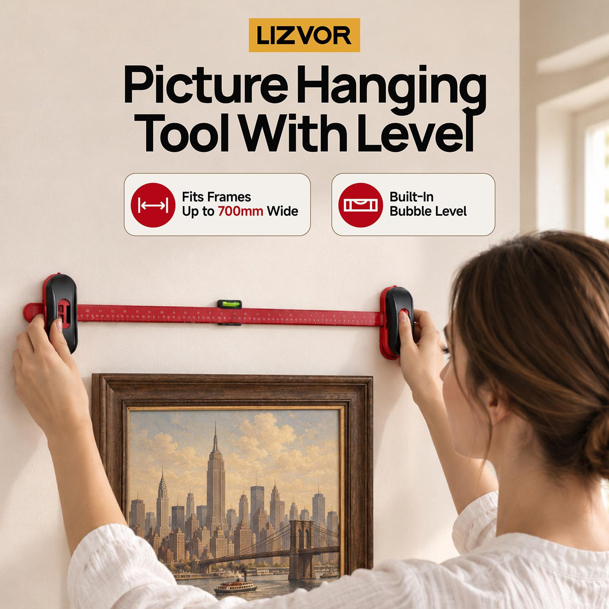 Picture hanging tool with level in use
